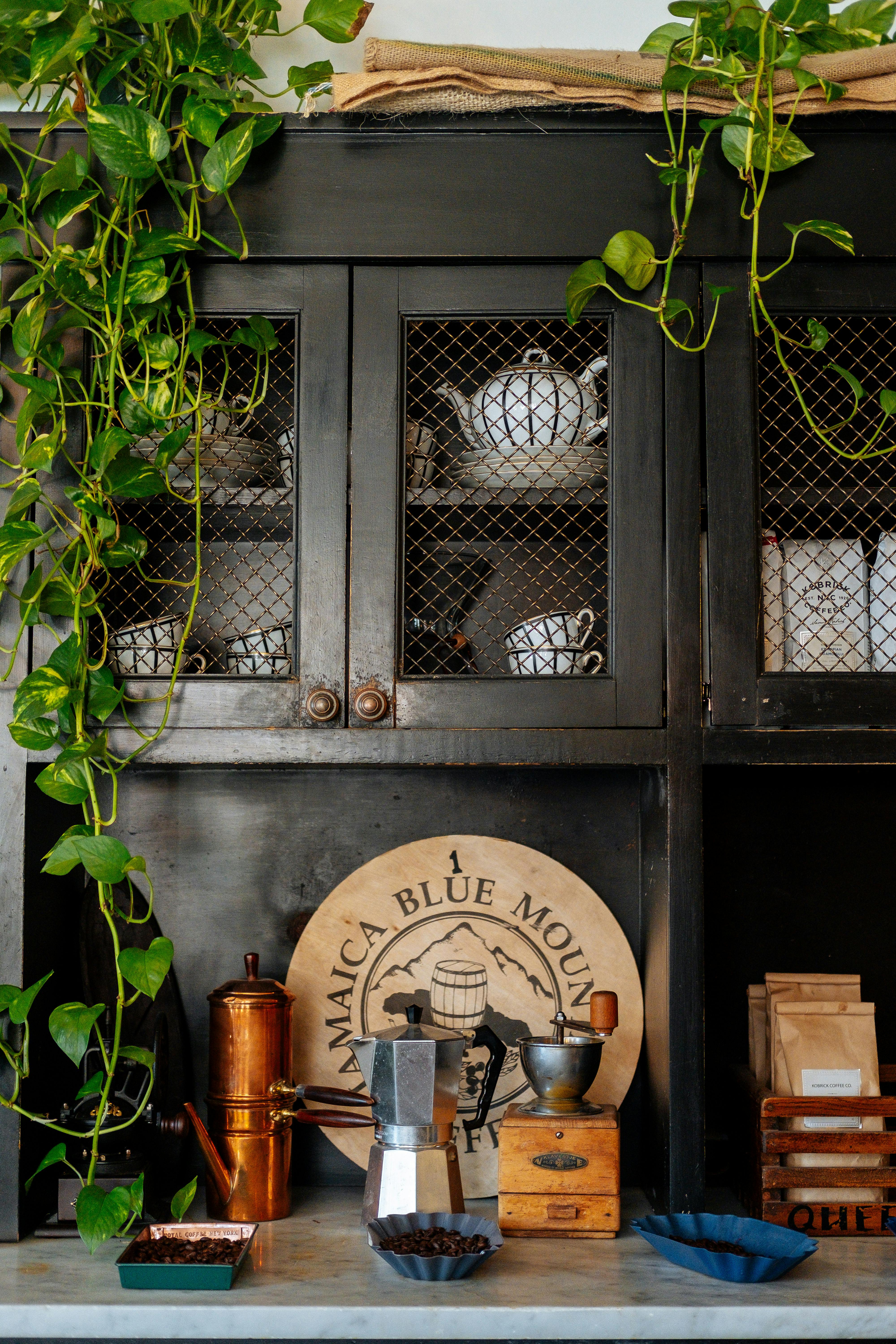 a moody black kitchen counter and cabinets